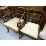A pair of antique chairs, one with elbow supports
