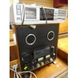 A Sony three-head stereo tape corder & an Akai stereo system