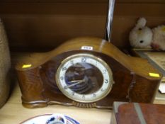 A 1930s polished mantel clock