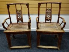 A PAIR OF CHINESE ROSEWOOD ALTAR ELBOW-CHAIRS having floral backs and solid seats