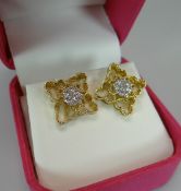 A PAIR OF MODERN 18K YELLOW GOLD & DIAMOND CLUSTER EARRINGS