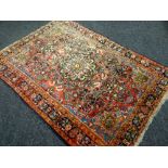 A MULTI-COLOURED PATTERNED RUG 206 x 145cms