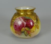A ROYAL WORCESTER BOWL of lobed form and painted with wild roses, signed M Hunt, 8cms high (