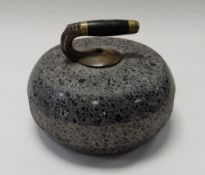 AN ANTIQUE GRANITE CURLING STONE having a brass and ebonized handle (consignment from BBC Bargain H