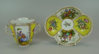 AN AUGUSTUS REX PORCELAIN CHOCOLATE CUP & SAUCER of lobed form, with twin handles and decorated with