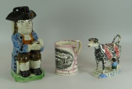 A RALPH WOOD TYPE STAFFORDSHIRE 'OLD TOBY PHILPOT' JUG with Toby seated with beer mug on knee and in