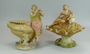 TWO ROYAL DUX FIGURES SEATED ON SHELLS one with flute (damage) and the other leaning on a spilling