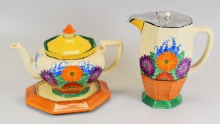 A CLARICE CLIFF 'GAY DAY TRIO' from the Bizarre series and composed of teapot, stand & jug