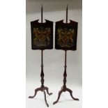 A PAIR OF POLE SCREENS with adjustable panels on long tripod pole supports, both panels with
