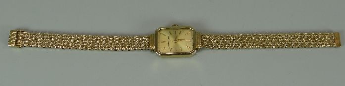 A 9CT YELLOW GOLD BUECHE-GIROD LADIES WRISTWATCH with automatic movement and on conforming