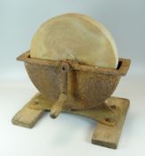 AN ANTIQUE ROTARY KNIFE SHARPENER having a 12-inch grindstone & on twin platform wooden base with w