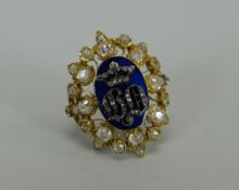 A VICTORIAN CUT DIAMOND & BLUE ENAMEL DRESS RING mounted in yellow gold with an oval leaf design,