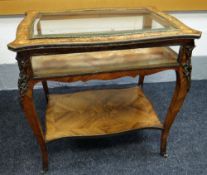 A FRENCH KINGWOOD BIJOUTERIE TABLE mounted with gilt metal decoration having floral marquetry to