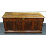 AN EIGHTEENTH CENTURY OAK COFFER having four ogee fielded panels to the facade, each panel with