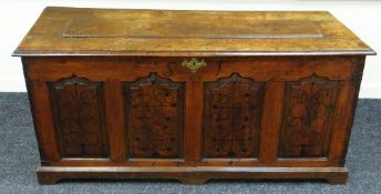 AN EIGHTEENTH CENTURY OAK COFFER having four ogee fielded panels to the facade, each panel with