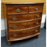 A GOOD VICTORIAN MAHOGANY BOW FRONT CHEST composed of three long & two short drawers with brass