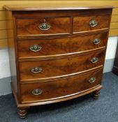 A GOOD VICTORIAN MAHOGANY BOW FRONT CHEST composed of three long & two short drawers with brass