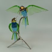 A BOXED SWAROVSKI GLASS SCULPTURE 'BEE EATERS' composed of two glass birds perched on a silver