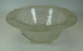 A CONTINENTAL FROSTED GLASS BOWL having a flared rim and on four pointed feet with all round mould