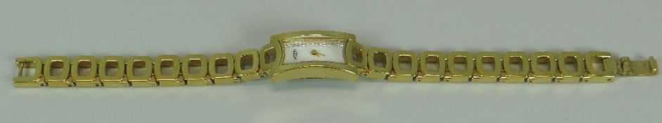 A MODERN YELLOW METAL ROTARY LADIES WATCH with geometric linked bracelet and curved white dial