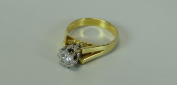 AN 18ct YELLOW GOLD DIAMOND SOLITAIRE ENGAGEMENT RING the diamond within an illusion setting and ha