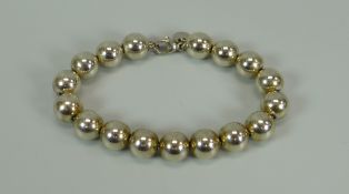 A 925 SILVER TIFFANY BEAD BRACELET with hallmarked circular tag to the clasp, 19gms
