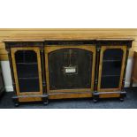 A FINE QUALITY VICTORIAN BREAKFRONT CREDENZA in ebony walnut and other wood composed of a centre