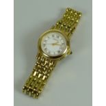 A MODERN YELLOW METAL 7300L SAPPHIRE CRYSTAL LADIES GUCCI WRISTWATCH with gate-link bracelet