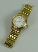 A MODERN YELLOW METAL 7300L SAPPHIRE CRYSTAL LADIES GUCCI WRISTWATCH with gate-link bracelet