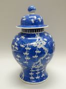 A LARGE CHINESE BLUE & WHITE PRUNUS JAR & COVER, damage, 42cms high