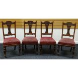 A SET OF FOUR TURN OF THE CENTURY CARVED CHAIRS with stuff over seats on turned supports