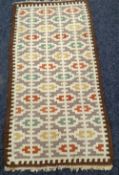 A SCANDINAVIAN RUG 133 x 71cms