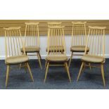 A SET OF SIX ERCOL BLONDE KITCHEN CHAIRS with tapering spindle backs