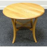 AN ERCOL BLONDE CIRCULAR TOPPED COFFEE TABLE on four bow supports with cross stretcher