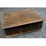 AN EARLY NINETEENTH CENTURY OAK BIBLE BOX having a carved facade initialled W P (for restoration)