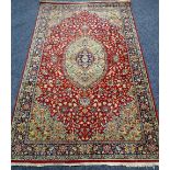 A RED & GREEN BRITISH WOVEN WOOL POLE RUG with traditional medallion design, 225 x 138cms