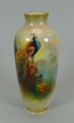 A SMALL NARROW-NECKED ROYAL WORCESTER VASE painted with peacocks in a fir tree, signed A Watkins,