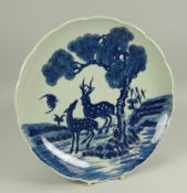 A CHINESE BLUE & WHITE DISH of lobed form, decorated with two deer beside a fir-tree in a landscape,