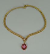 A MIDDLE-EASTERN 18K YELLOW GOLD FLAT NECKLACE with pink stone pendant, 29gms gross