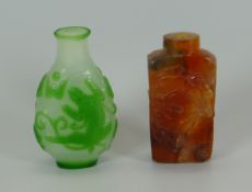 TWO CHINESE SNUFF BOTTLES with red overlay, 7cms high