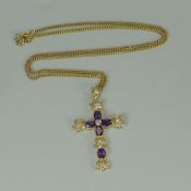 AN AMETHYST & SEVEN DIAMOND CRUCIFIX set in 9ct yellow gold on a 9ct fine necklace, 12.8gms