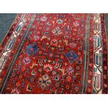 LARGE FULL PILE PERSIAN RED GROUND RUNNER with all over design, 314 x 112cms