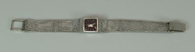 A 9CT WHITE GOLD ROTARY WRISTWATCH on conforming textured flat 9ct bracelet, 23.7gms