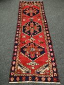 A BLUE & PINK GROUND PERSIAN HERIZ RUNNER 256 x 89cms