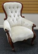 A LATE VICTORIAN MAHOGANY FRAMED BUTTON BACKED ARMCHAIR