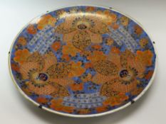 A LARGE CIRCULAR IMARI CHARGER profusely decorated in rust, gilding and blue glazes, six character