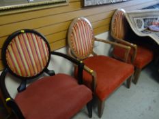 Pair of modern elbow chairs and an ebonized similar