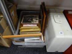 Box of framed prints and a sewing machine