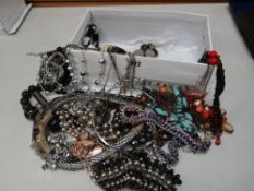 Box of costume jewellery, boxed lighter etc
