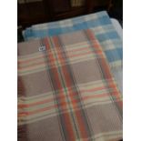 Checkered multi-coloured Welsh blanket and a similar in blue and white